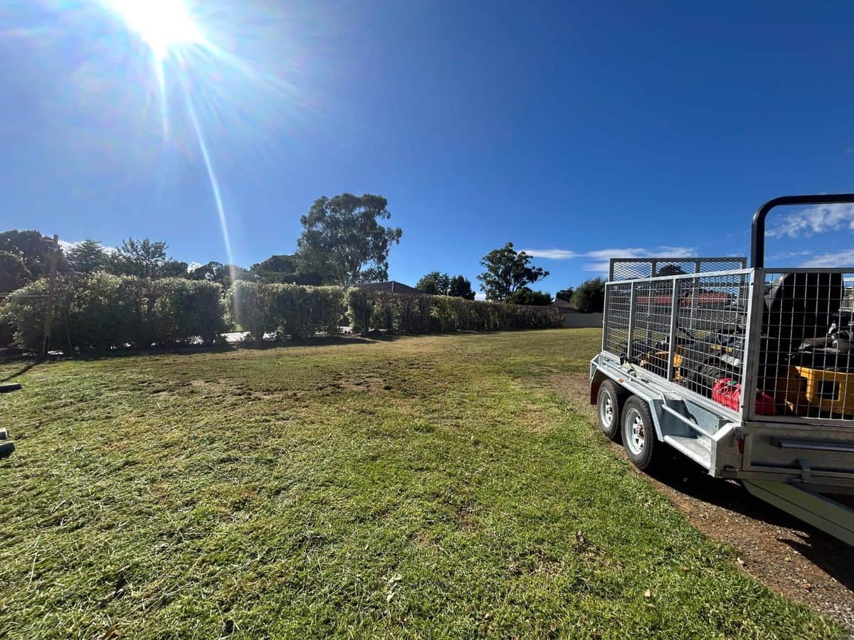 Terra Maintenance caged trailer loaded on a cleared property in Melbourne's outer south-east